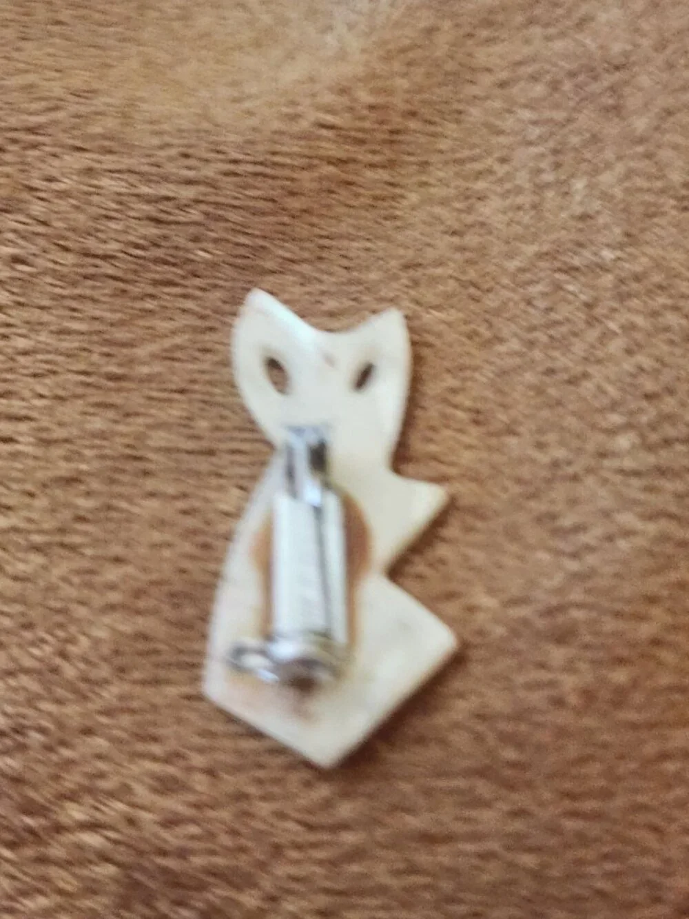 hand-carved mother-of-pearl or shell cat figural brooch